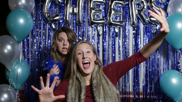 Festival supporters Debralyn Lazarescu (left) and Hannah Chargin (right) in the photo booth at the Cheers to BWiFF 2017 Fundraiser in Palatine.