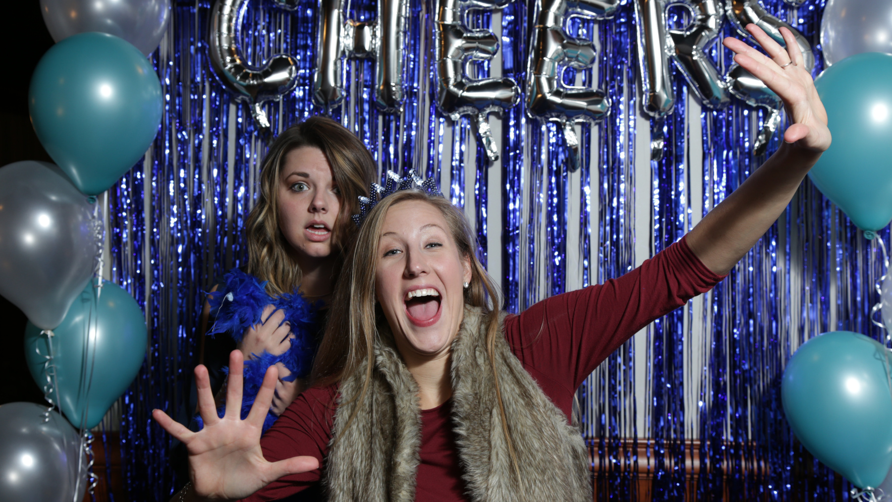 Festival supporters Debralyn Lazarescu (left) and Hannah Chargin (right) in the photo booth at the Cheers to BWiFF 2017 Fundraiser in Palatine.