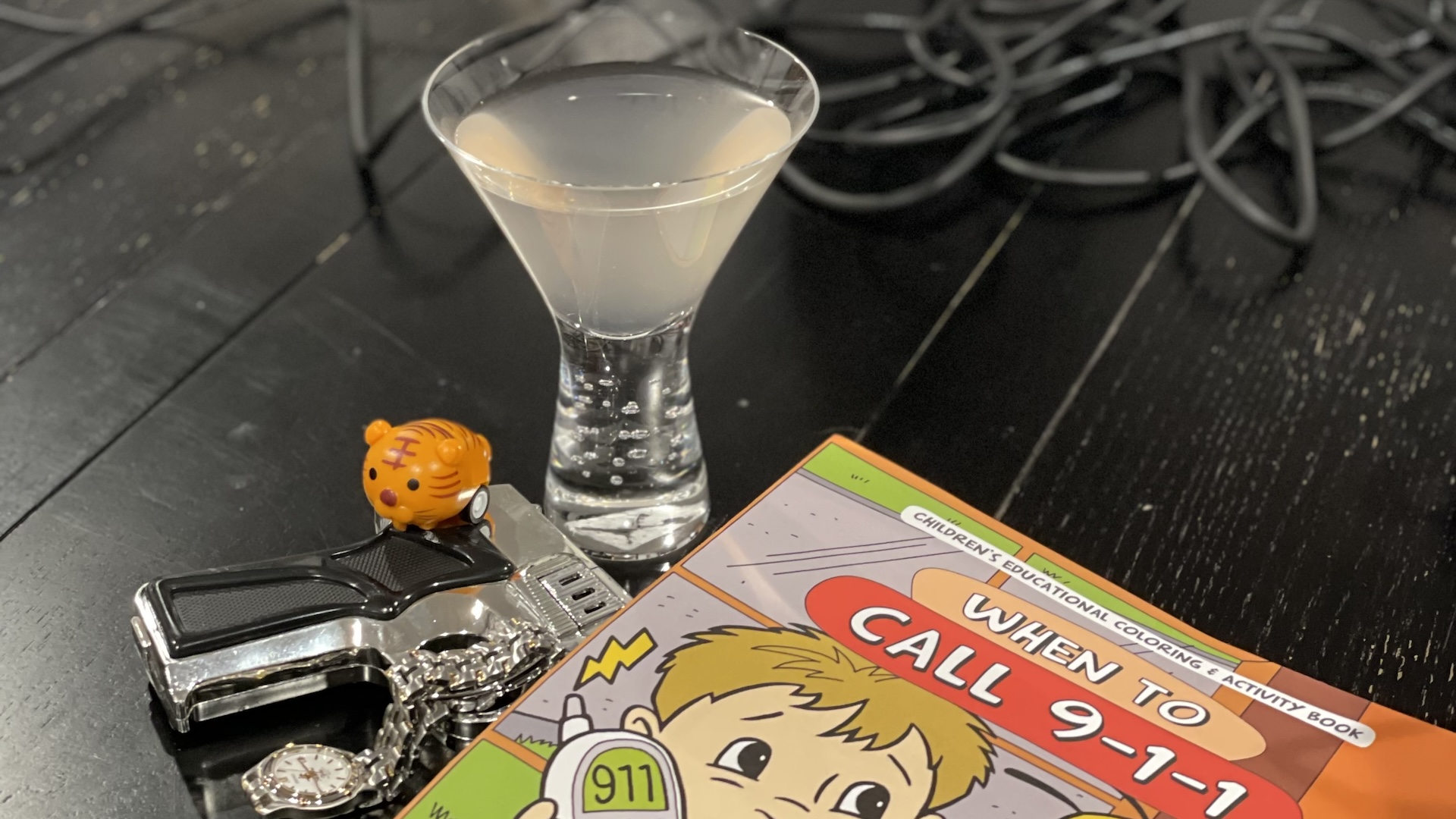 Cocktail for 'Speed' with a cheap watch, gun, wildcat, and when to call 9-1-1 children's book